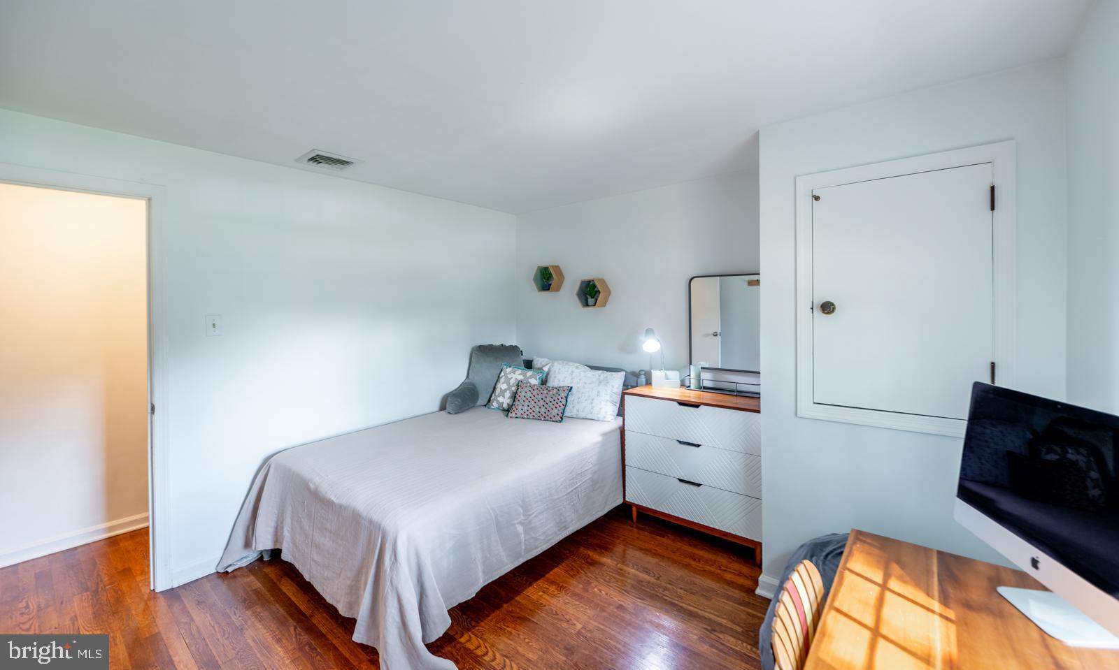 22 Salisbury Lane Malvern, PA 19355 - Photo 26 of 57 a bedroom with a bed and wooden floor