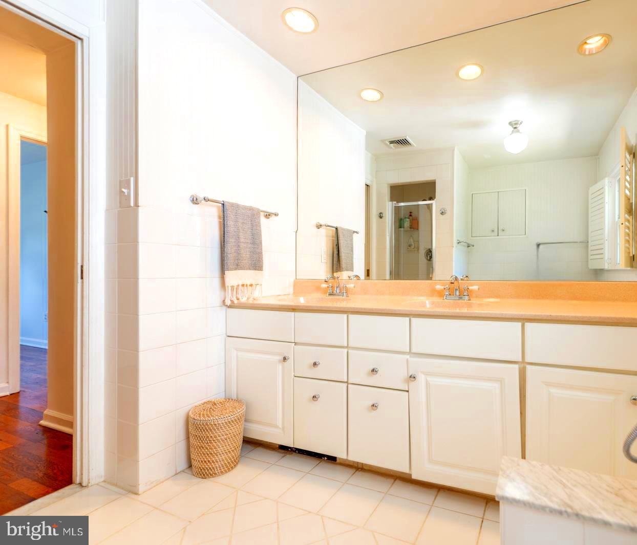 22 Salisbury Lane Malvern, PA 19355 - Photo 29 of 57 a bathroom with a sink and a mirror