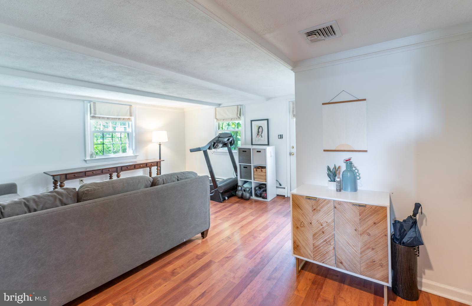 22 Salisbury Lane Malvern, PA 19355 - Photo 36 of 57 a living room with furniture and a wooden floor