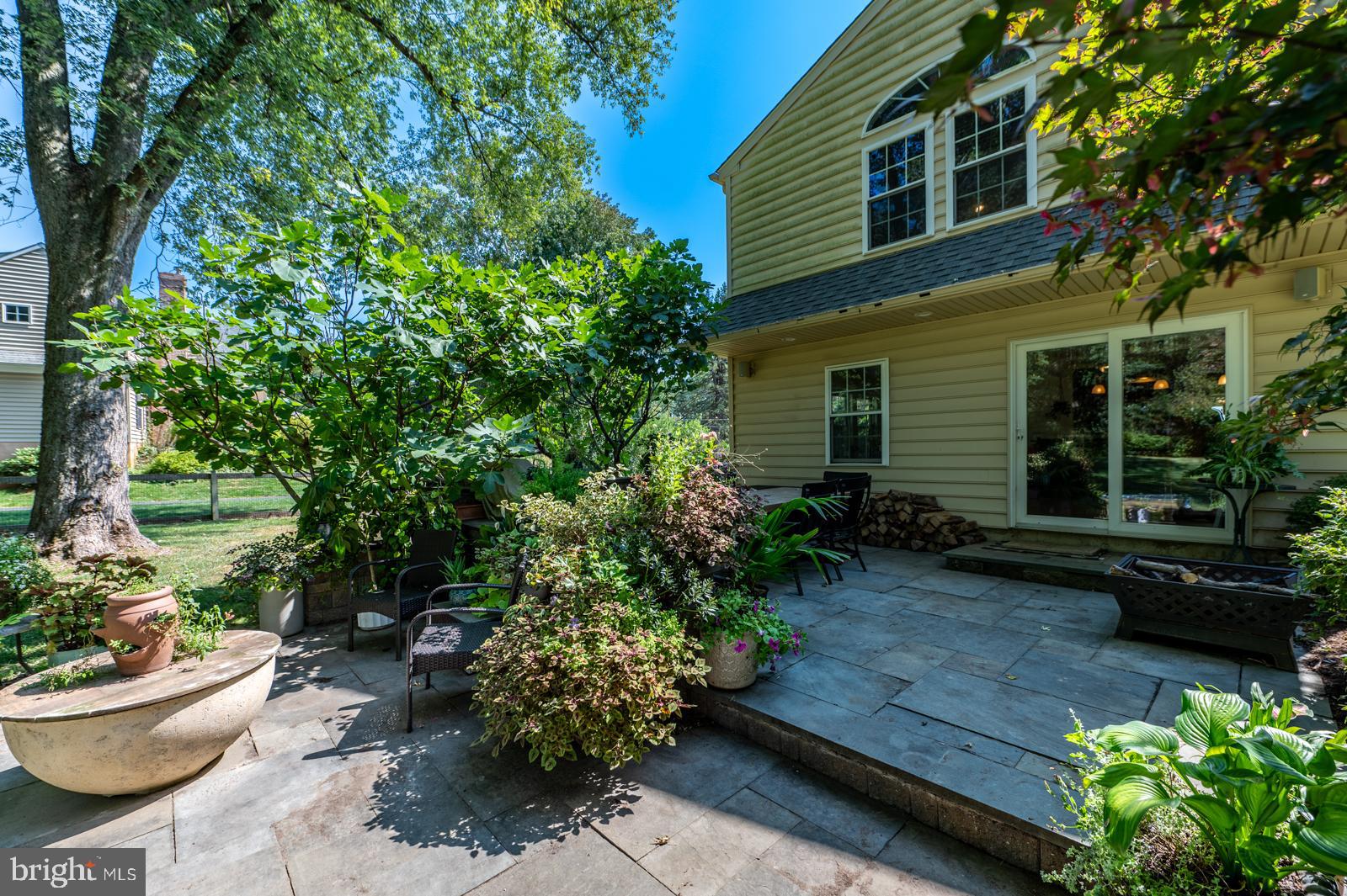 22 Salisbury Lane Malvern, PA 19355 - Photo 47 of 57 a view of a backyard with chair and potted plants