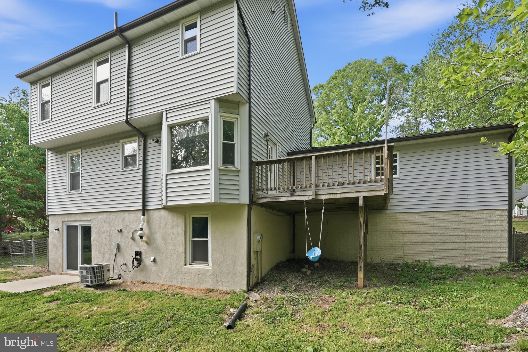 124 Oaklawn Road Stafford, VA 22554 - Photo 11 of 36 a front view of a house with a yard