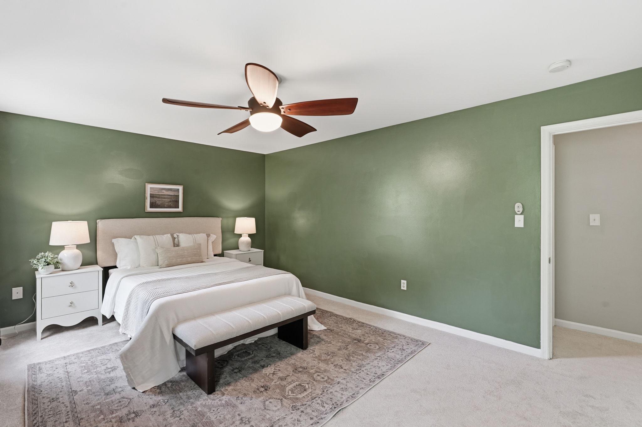 124 Oaklawn Road Stafford, VA 22554 - Photo 19 of 36 a bedroom with a bed and a chandelier