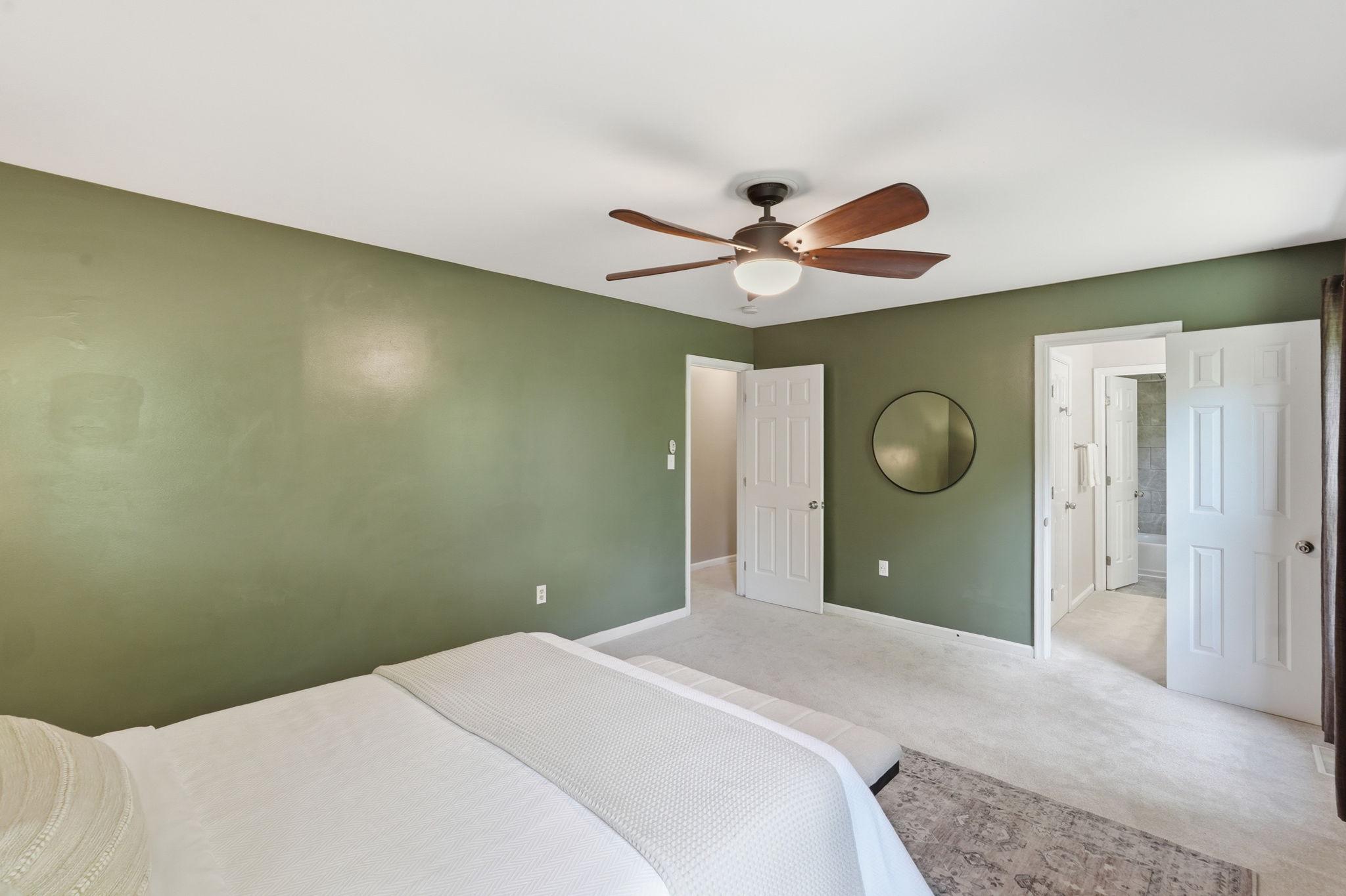 124 Oaklawn Road Stafford, VA 22554 - Photo 20 of 36 a bedroom with a bed and a chandelier