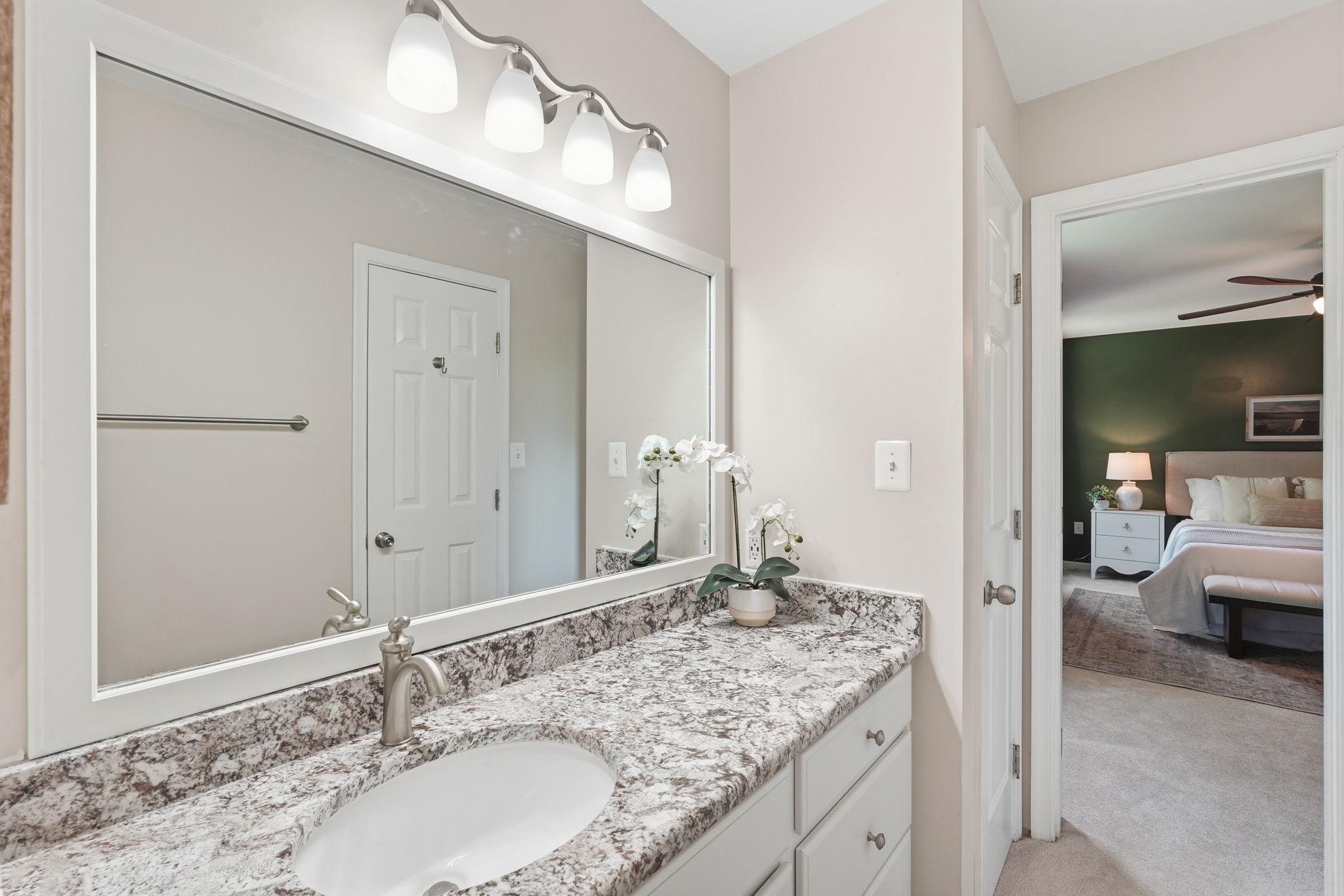 124 Oaklawn Road Stafford, VA 22554 - Photo 22 of 36 a bathroom with a granite countertop sink and a mirror