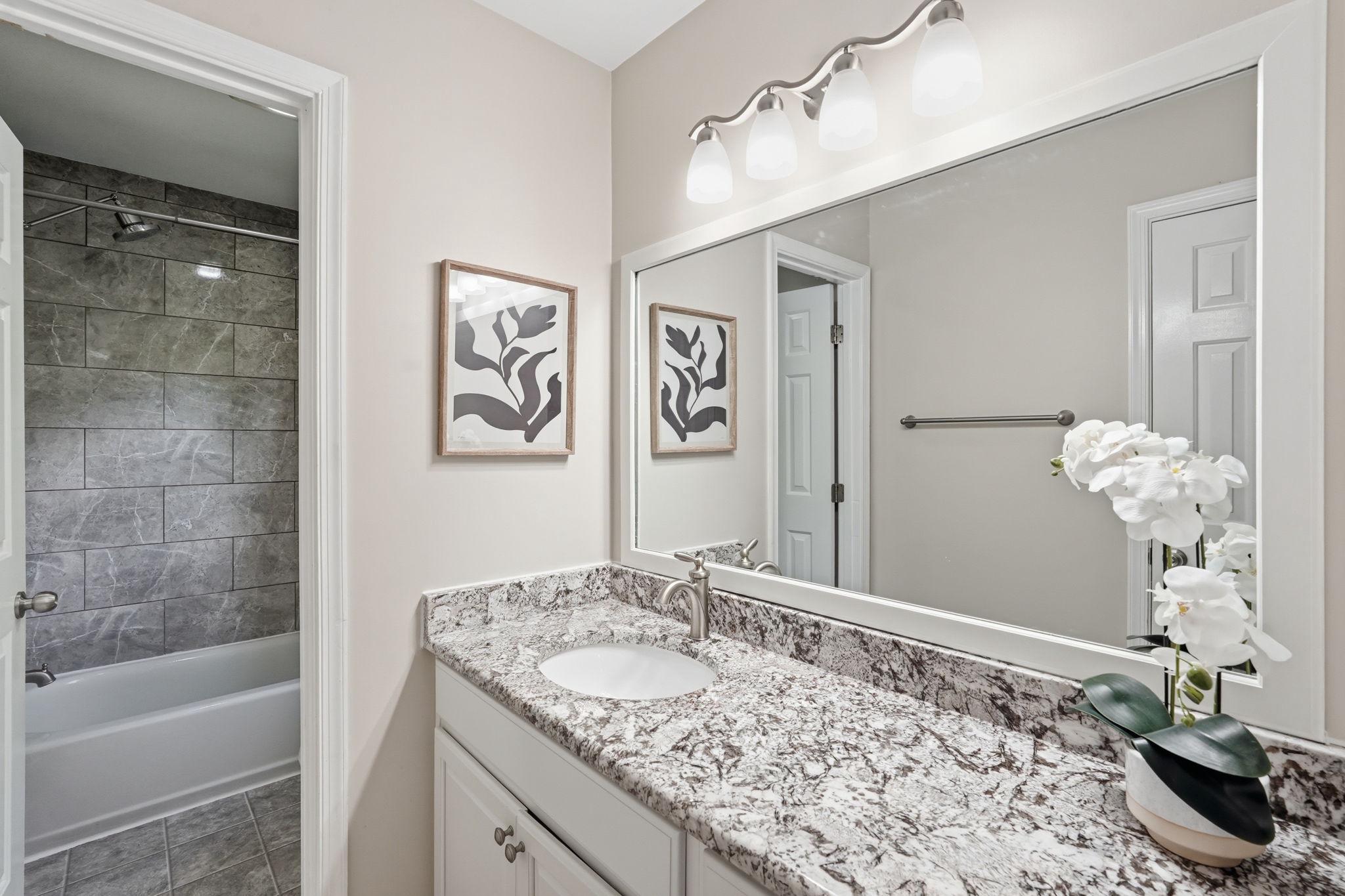 124 Oaklawn Road Stafford, VA 22554 - Photo 23 of 36 a bathroom with a granite countertop sink a toilet and shower