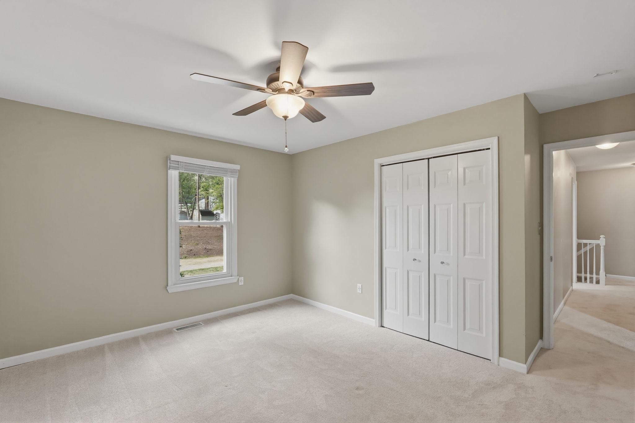 124 Oaklawn Road Stafford, VA 22554 - Photo 25 of 36 an empty room with windows and fan