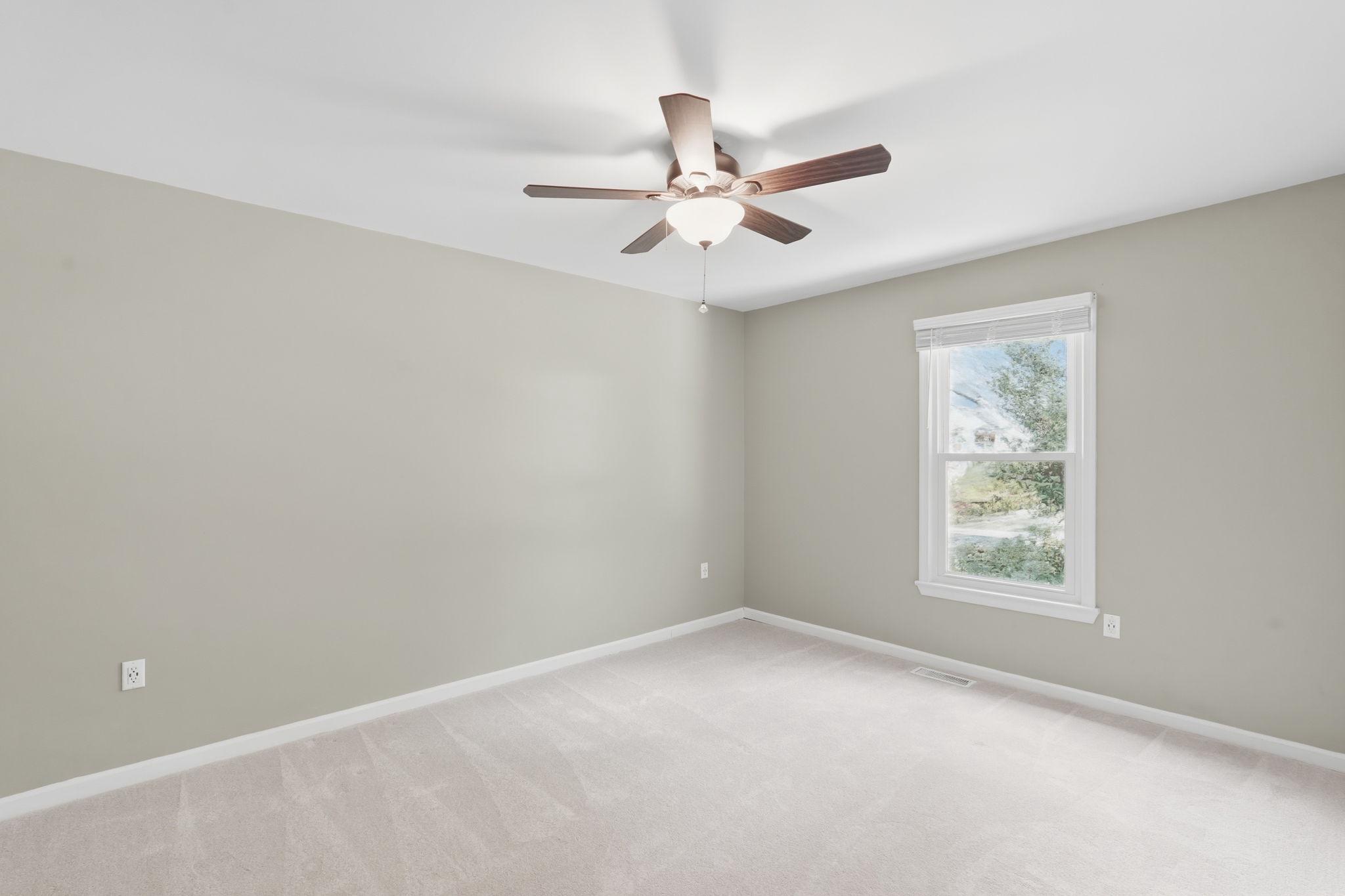 124 Oaklawn Road Stafford, VA 22554 - Photo 26 of 36 an empty room with windows and fan