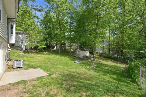 a backyard of a house with lots of green space