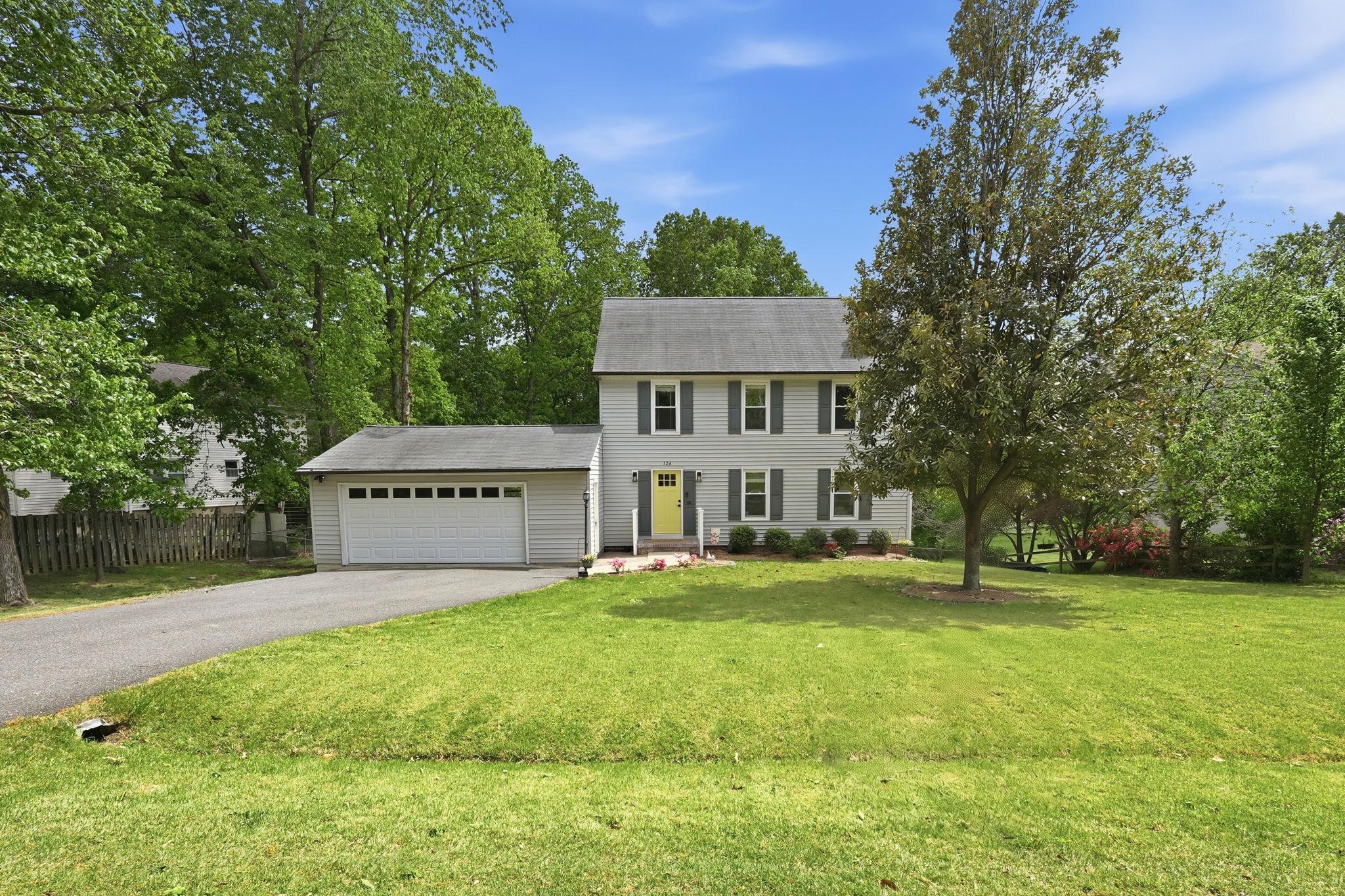124 Oaklawn Road Stafford, VA 22554 - Photo 34 of 36 a view of a house with a big yard and large trees