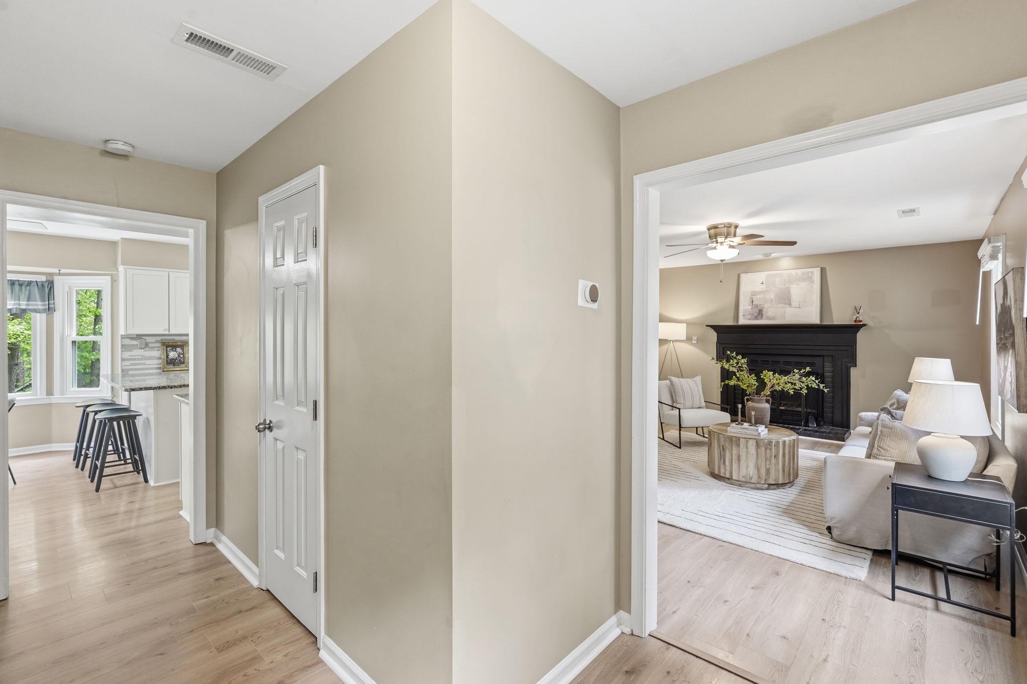 124 Oaklawn Road Stafford, VA 22554 - Photo 6 of 36 a hallway with a dining table and chairs