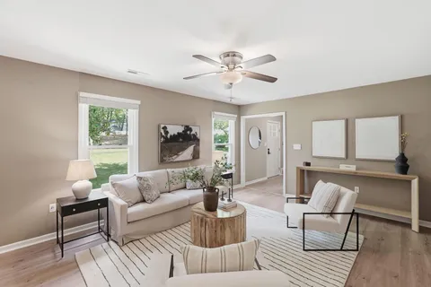 a living room with furniture and a large window