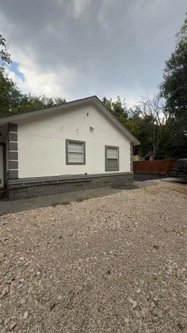 a house view with a backyard space