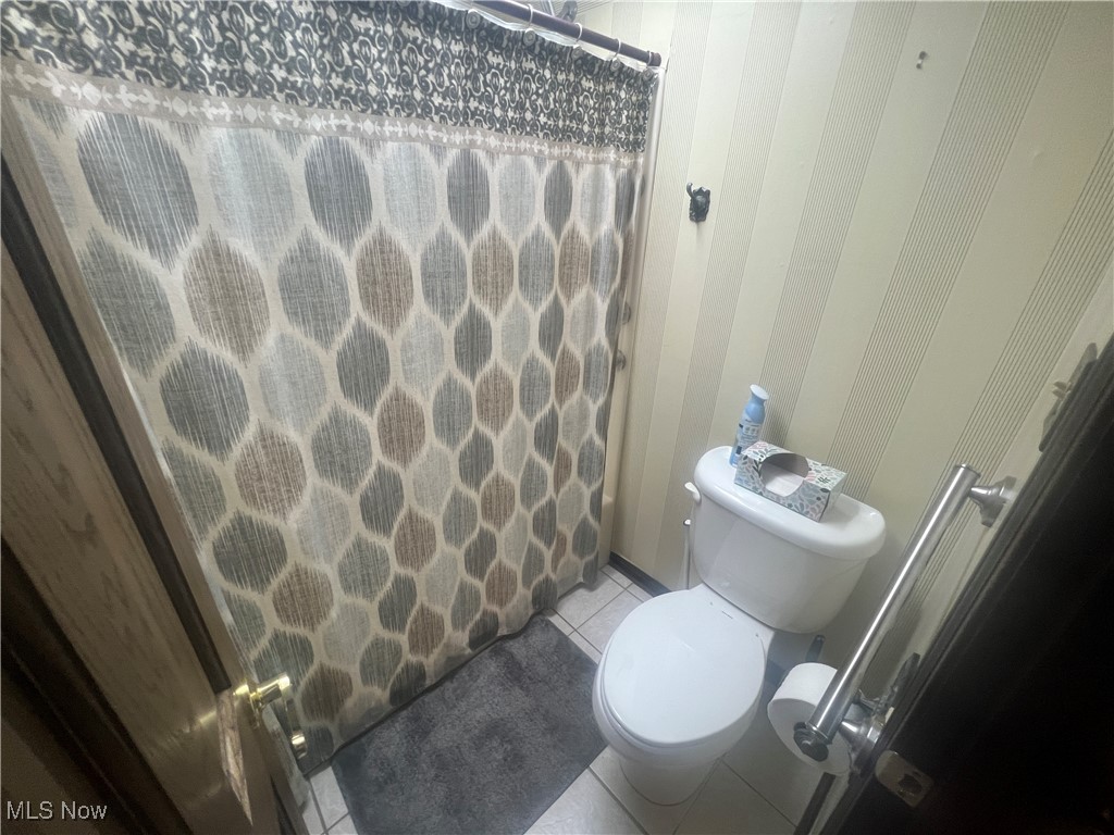 86301 North Bay Road Scio, OH 43988 - Photo 24 of 50 Bathroom with tile patterned floors, walk in shower, and toilet