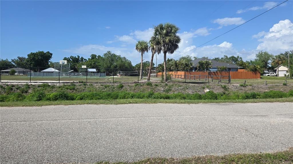 Rolla Road Venice, FL 34293 - Photo 4 of 6 a front view of a house with a yard and palm trees