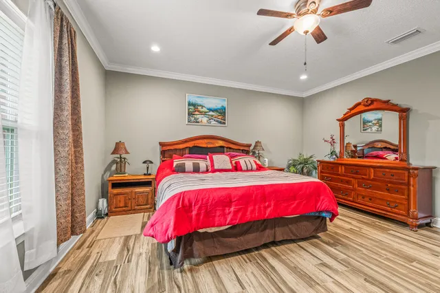 a bedroom with a bed and a dresser