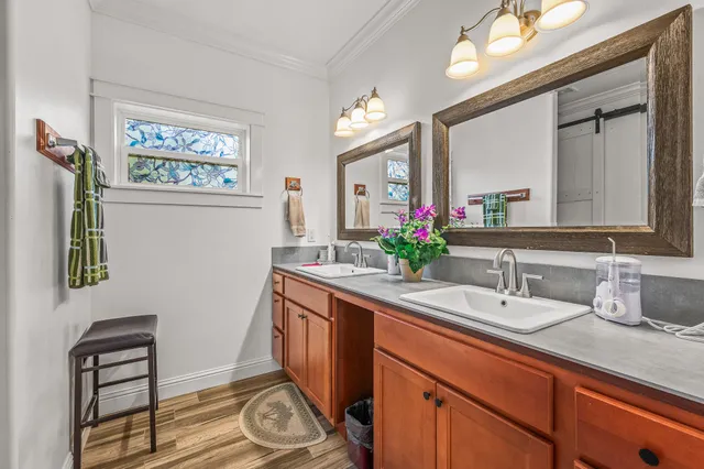 a bathroom with a sink a vanity and a mirror