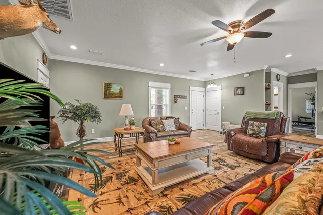 a view of a hallway with wooden floor and furniture