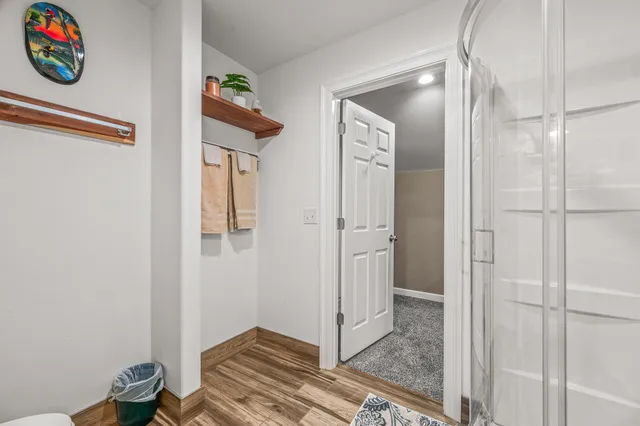 a backyard of a house with table and chairs