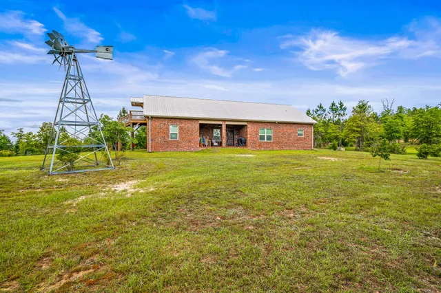 a view of a house with a big yard