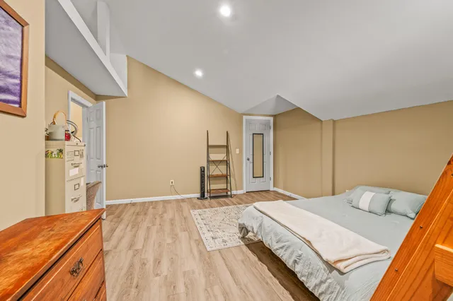 a backyard of a house with lots of green space and a lake view