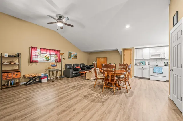 a view of a green field with lots of bushes