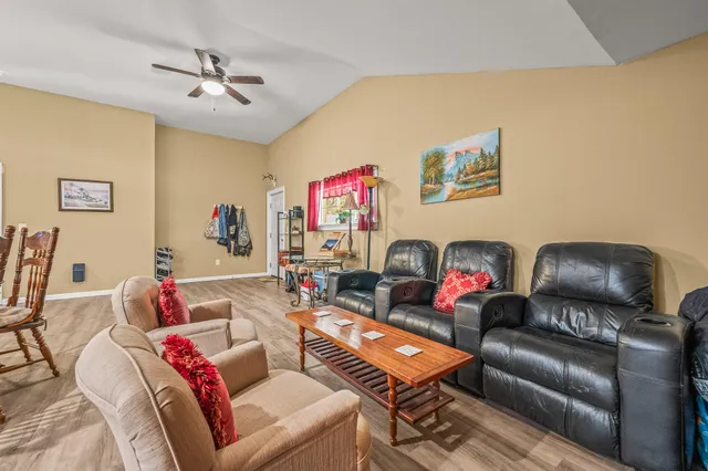 a backyard of a house with a yard and outdoor seating