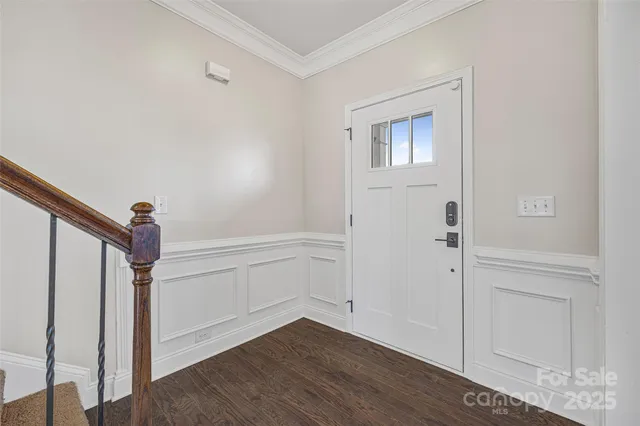 a view of entryway with wooden floor