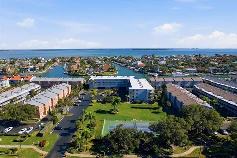 an aerial view of a house with a ocean view