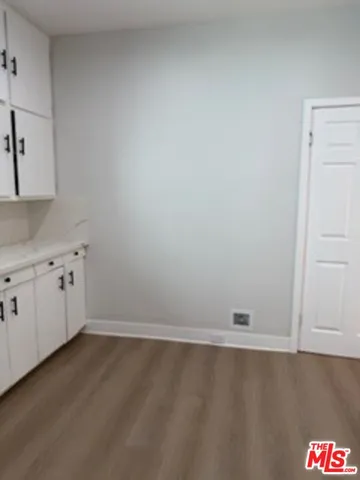 a view of storage and utility room with window