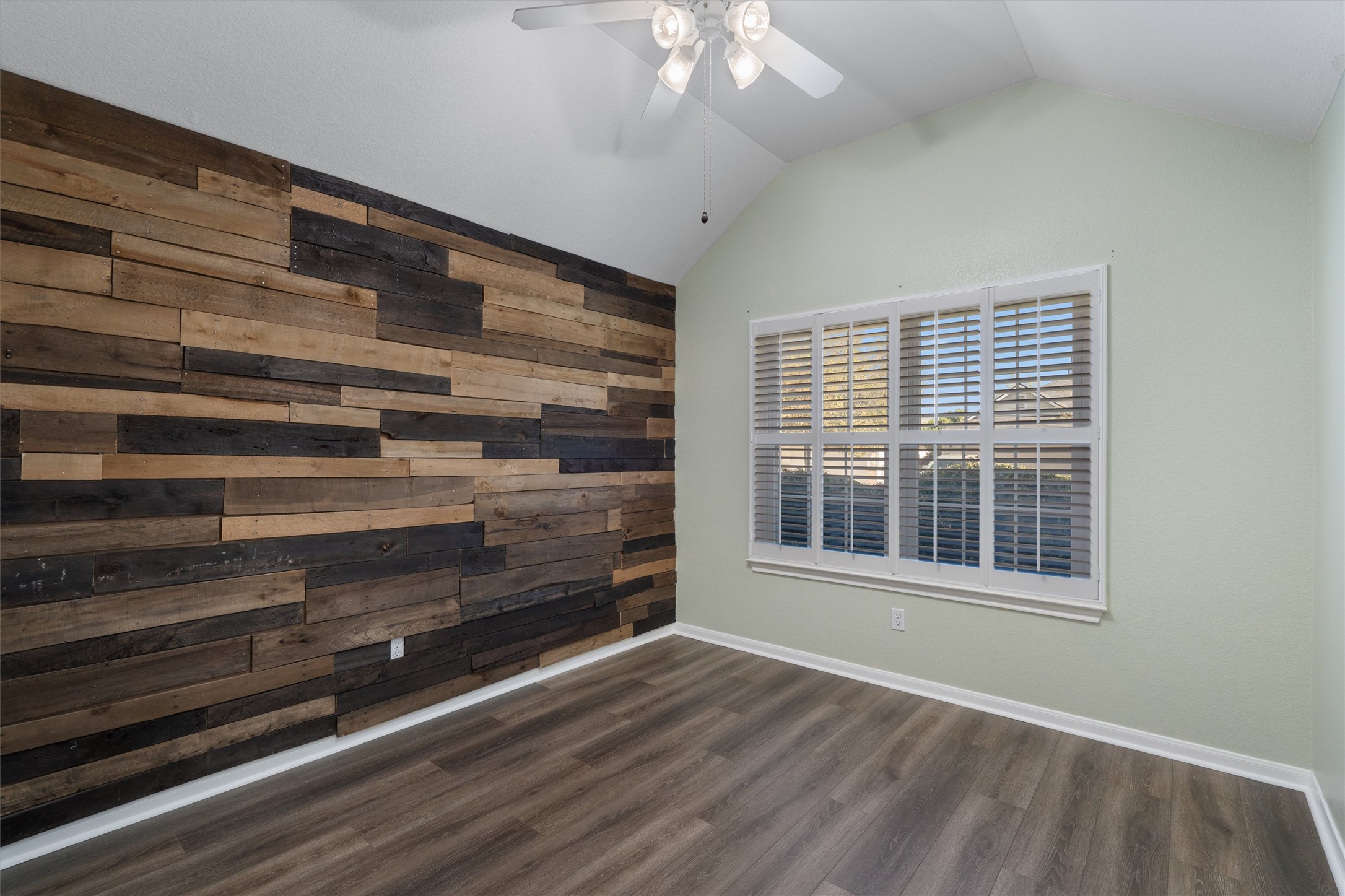153 Hickory Lane Georgetown, TX 78633 - Photo 22 of 30 Accent wall featuring varied wood paneling