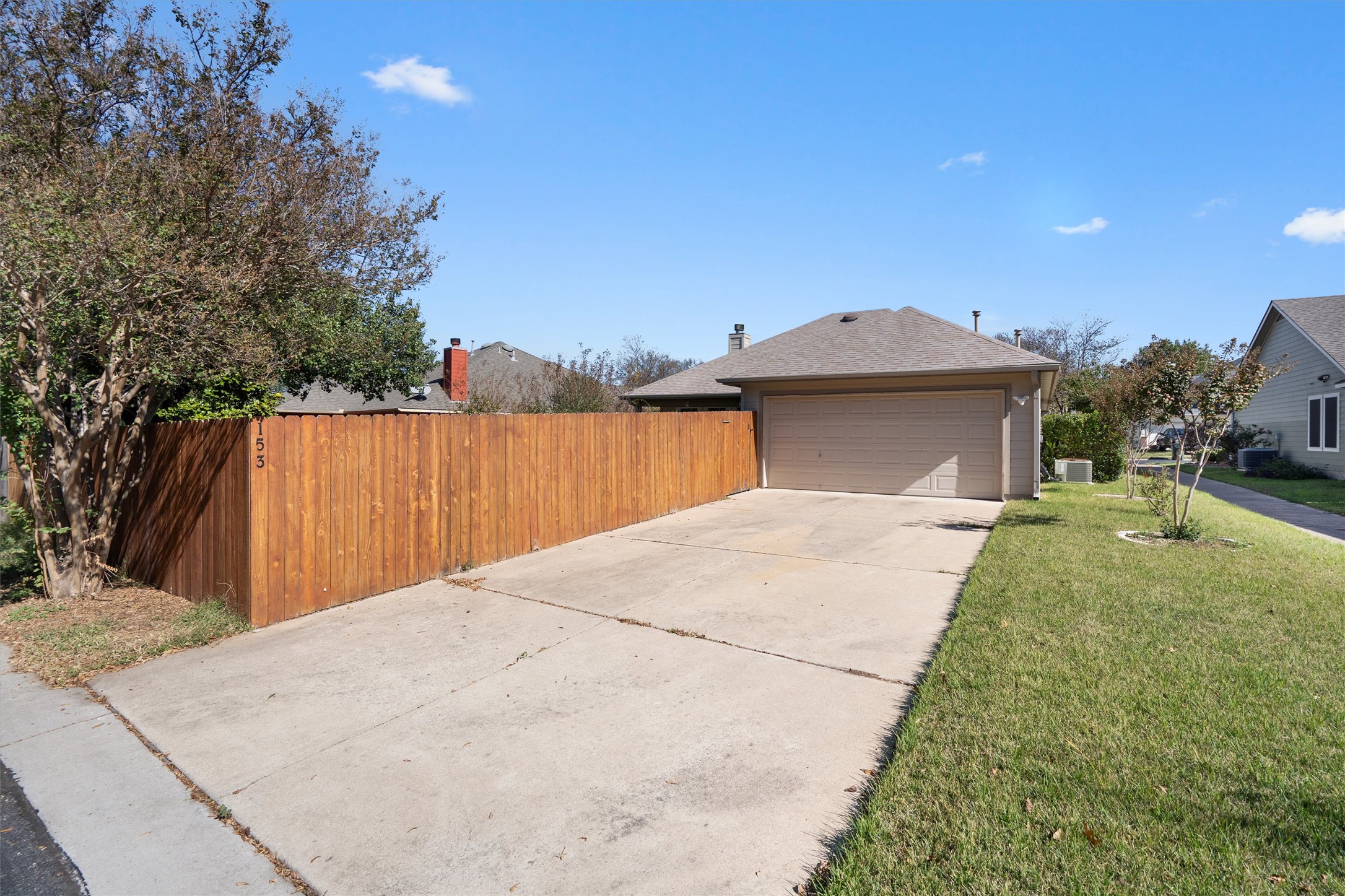 153 Hickory Lane Georgetown, TX 78633 - Photo 30 of 30 Attached two-car garage with a concrete driveway