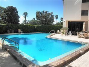 435 South Gulfstream Avenue, Unit 906 Sarasota, FL 34236 - Photo 15 of 22 a view of a swimming pool with a patio