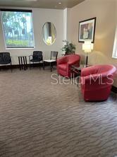 435 South Gulfstream Avenue, Unit 906 Sarasota, FL 34236 - Photo 17 of 22 a living room with furniture window and wooden floor