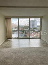 435 South Gulfstream Avenue, Unit 906 Sarasota, FL 34236 - Photo 4 of 22 a view of an empty room with a window
