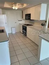 a kitchen with stainless steel appliances a stove a sink and a microwave