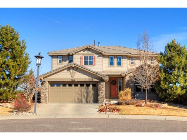 9068 Sturbridge Place Highlands Ranch, CO 80129 - Photo 1 of 1 a front view of a house with a yard