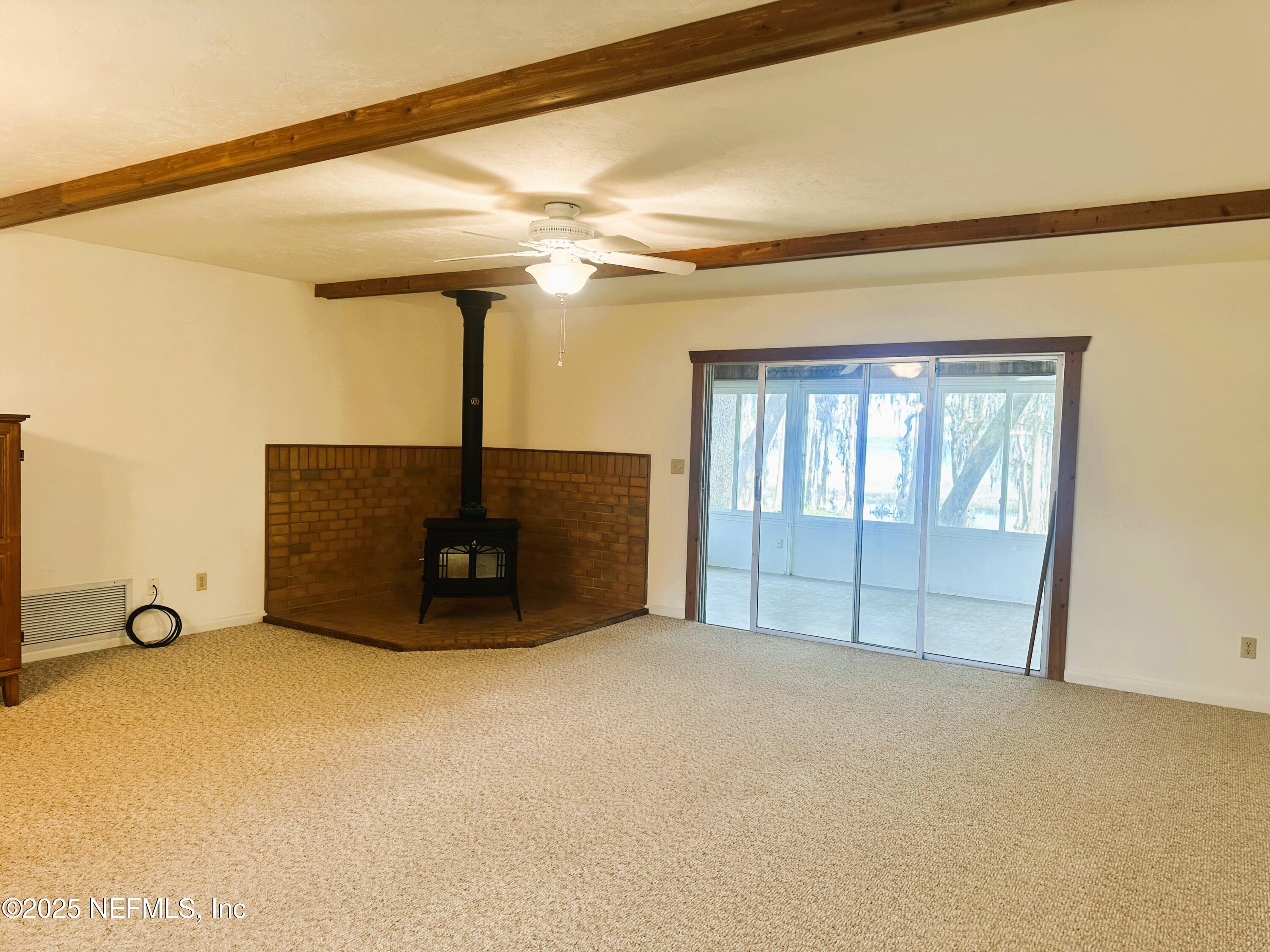 9817 County Road 1469 Earleton, FL 32631 - Photo 8 of 23 a view of an empty room with windows