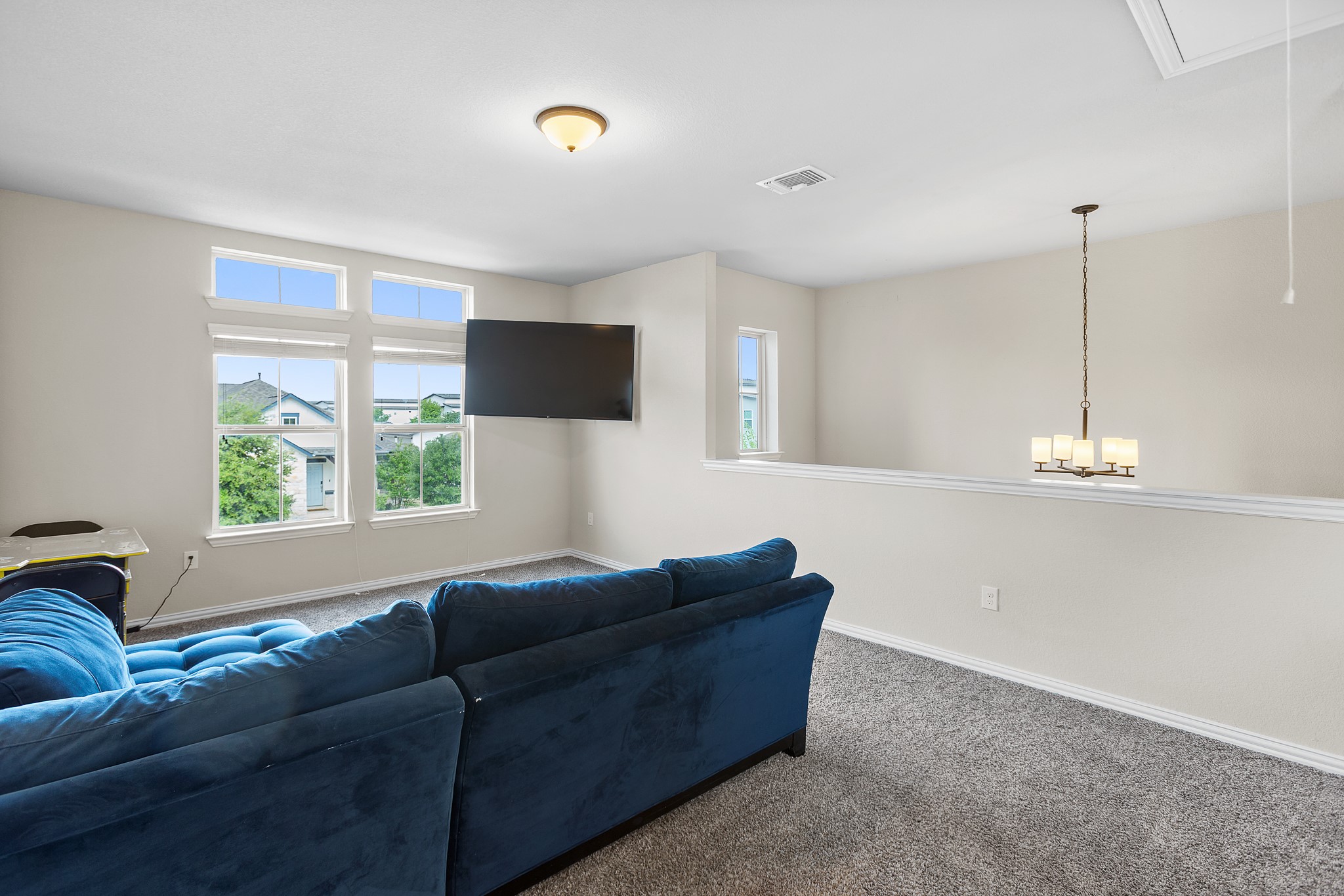 8709 Slater Drive Austin, TX 78747 - Photo 24 of 36 a living room with furniture and a window