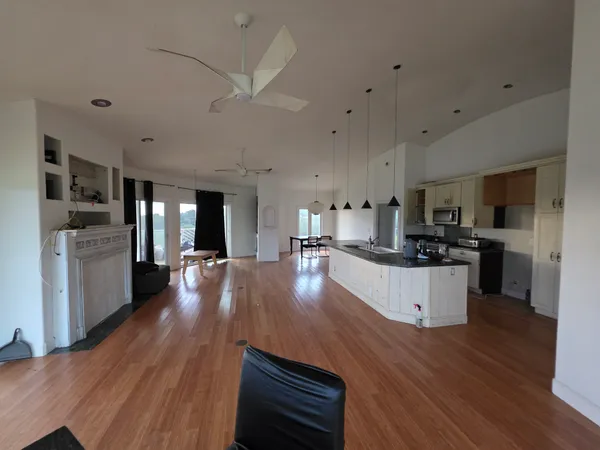 a view of a lake with a house in the background