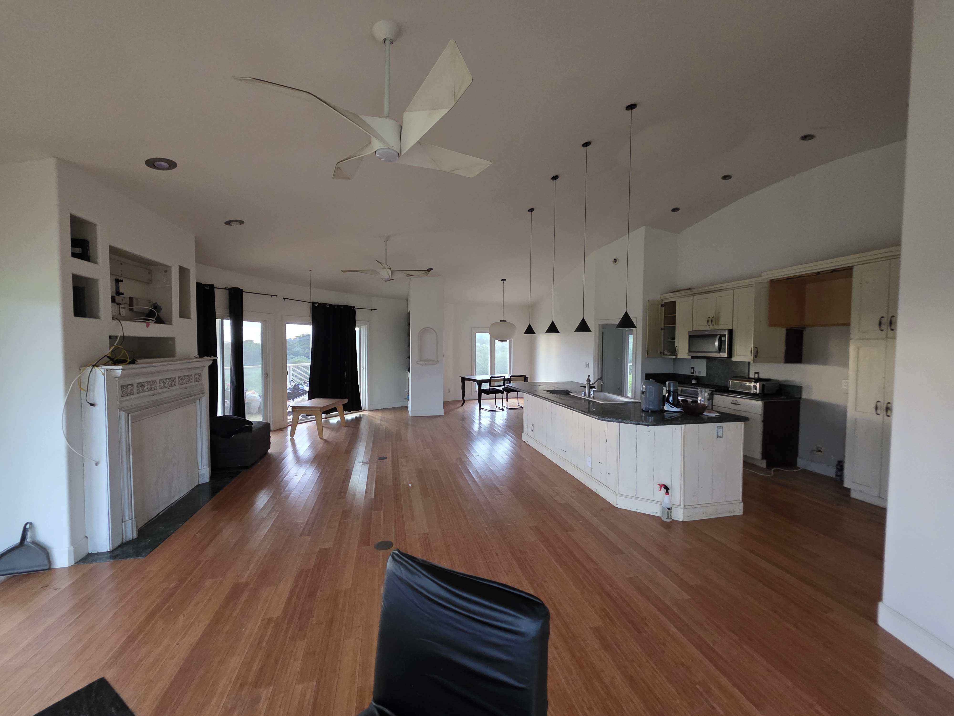 6469 L Kawaihau Road Kapaa, HI 96746 - Photo 6 of 12 a large kitchen with kitchen island a large counter top space a sink stainless steel appliances and cabinets