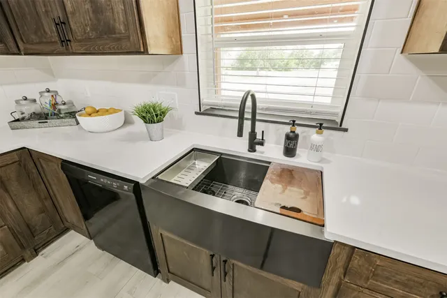 a close view of sink and cabinets