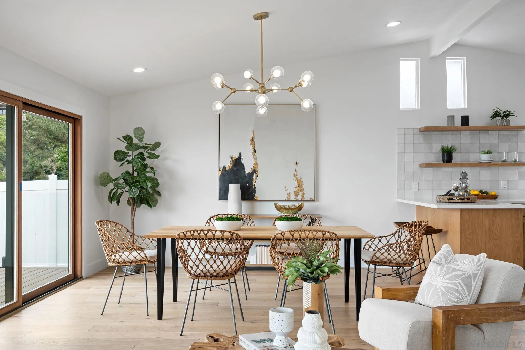 2364 Rue Adriane La Jolla, CA 92037 - Photo 15 of 27 a view of a dining room with furniture window and wooden floor