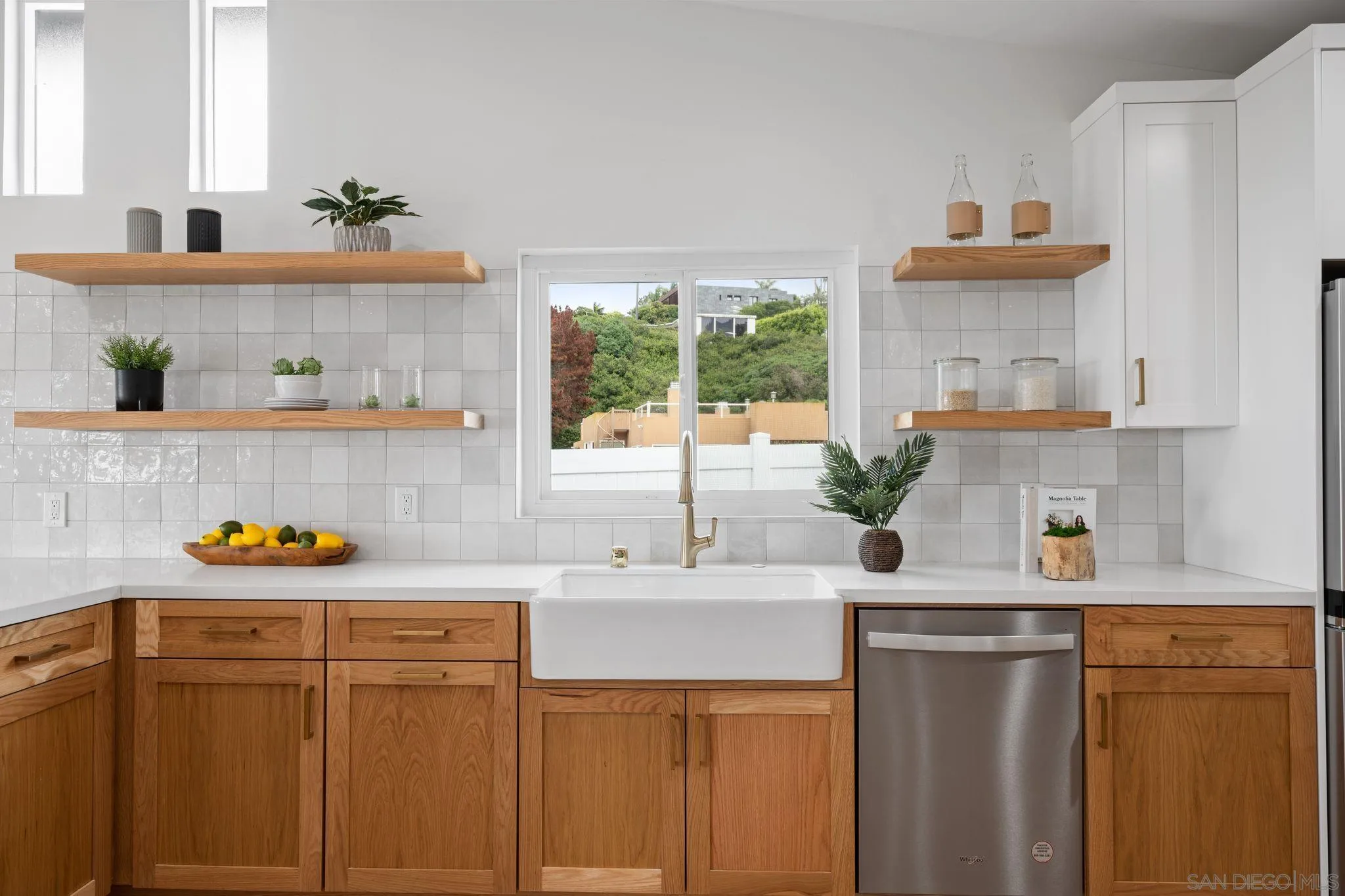 2364 Rue Adriane La Jolla, CA 92037 - Photo 10 of 27 a kitchen with stainless steel appliances a sink and a refrigerator