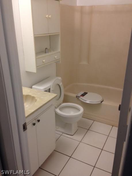 8061 Country Road, Unit 201 Fort Myers, FL 33919 - Photo 8 of 10 a bathroom with a granite countertop sink and a toilet