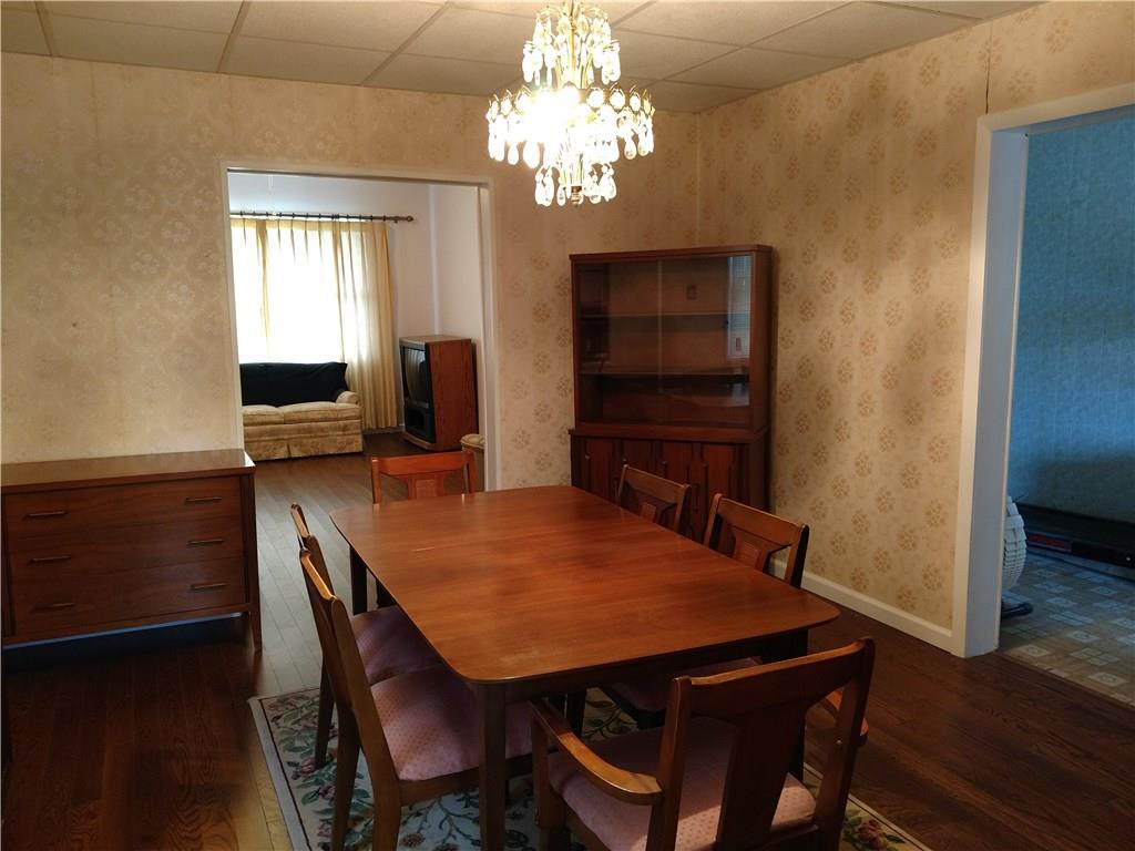 471 Park Street Rochester, PA 15074 - Photo 3 of 10 a view of a dining room with furniture and wooden floor