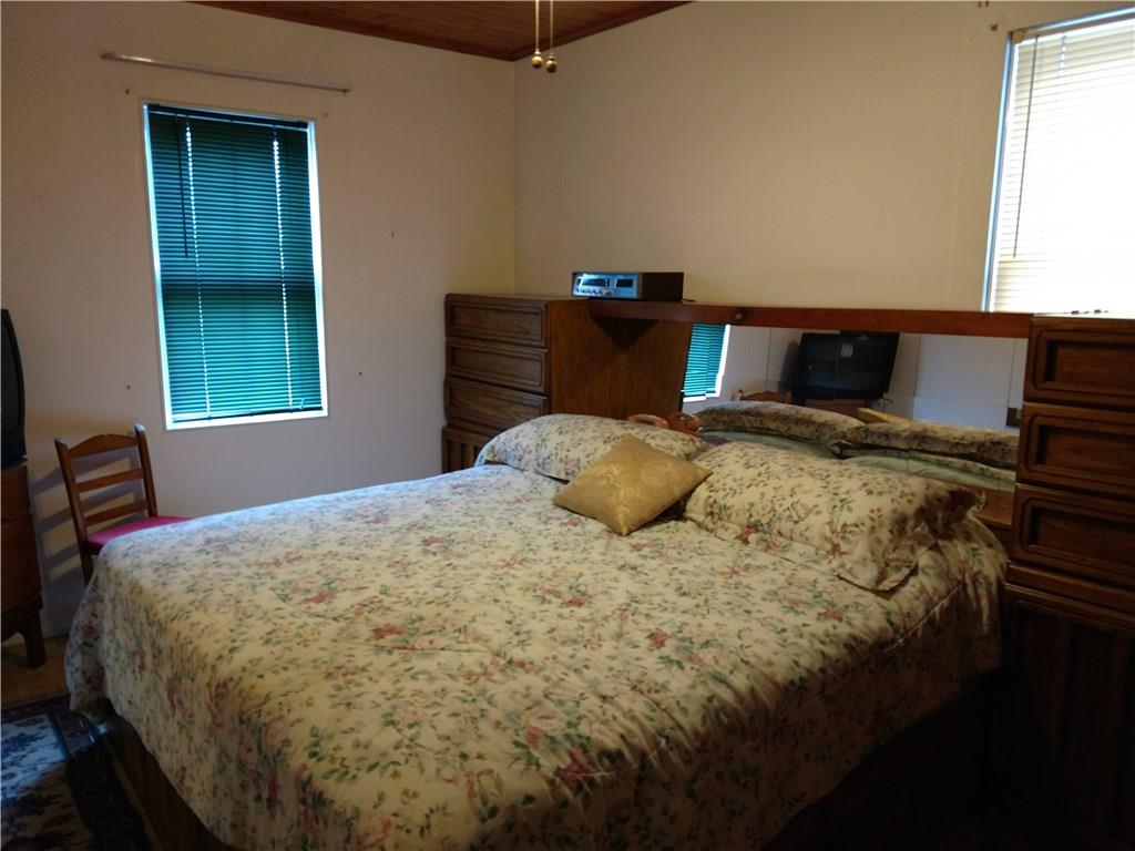 471 Park Street Rochester, PA 15074 - Photo 7 of 10 a bed sitting in a bedroom next to a window