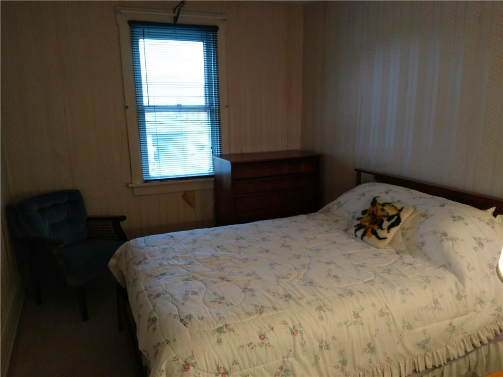 471 Park Street Rochester, PA 15074 - Photo 8 of 10 a bedroom with a bed and a window