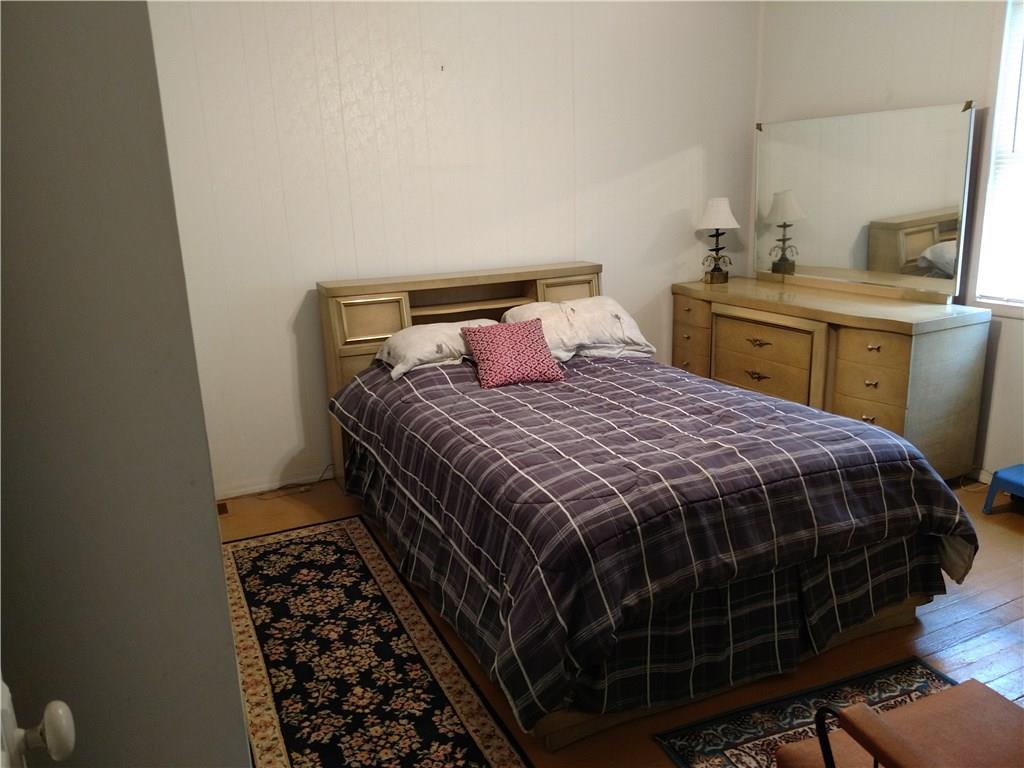 471 Park Street Rochester, PA 15074 - Photo 9 of 10 a bedroom with a bed and a desk