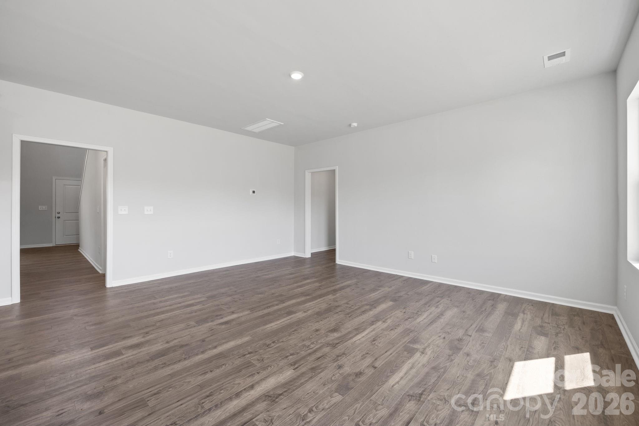 426 Brick House Road York, SC 29745 - Photo 17 of 35 a view of an empty room with wooden floor and a window