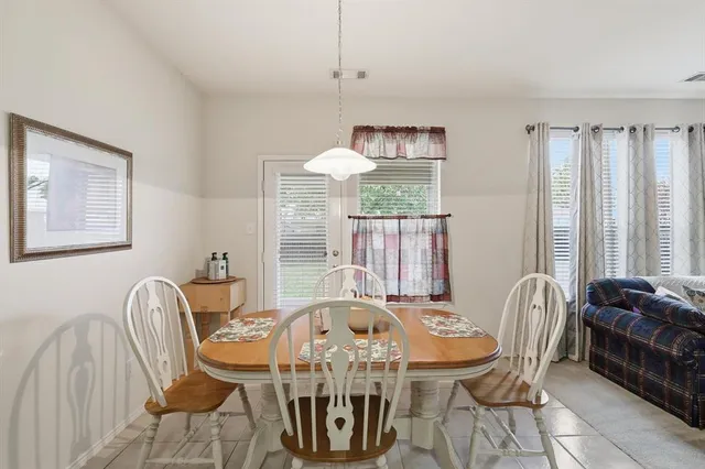 a kitchen with a sink appliances and cabinets